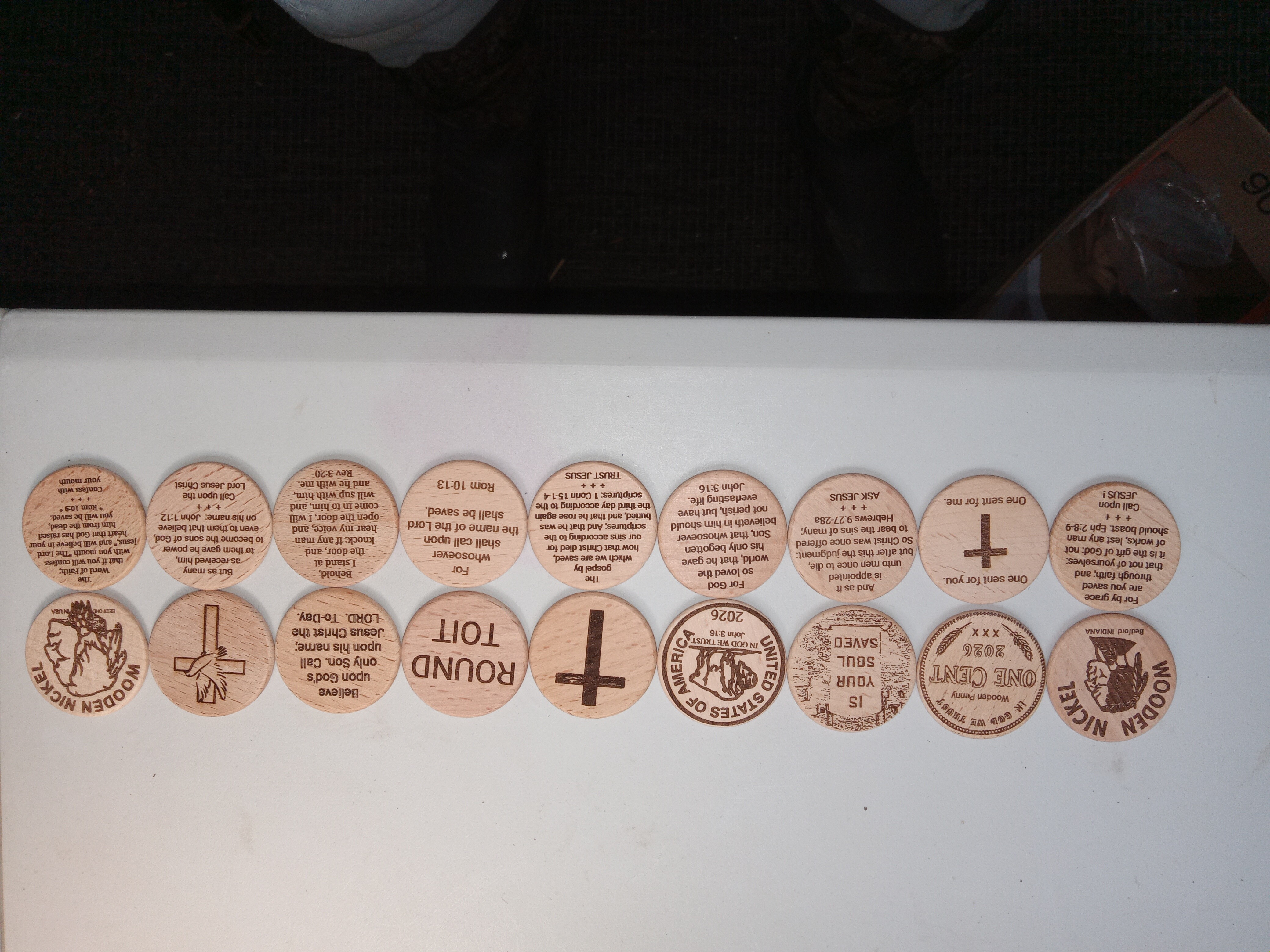 Complete wooden nickel gospel token catalog showing all 28 designs - front and back